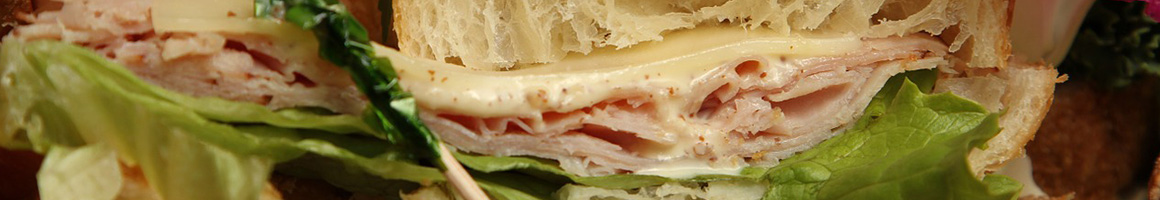 Eating Sandwich at DiBella's Subs restaurant in Hamden, CT.